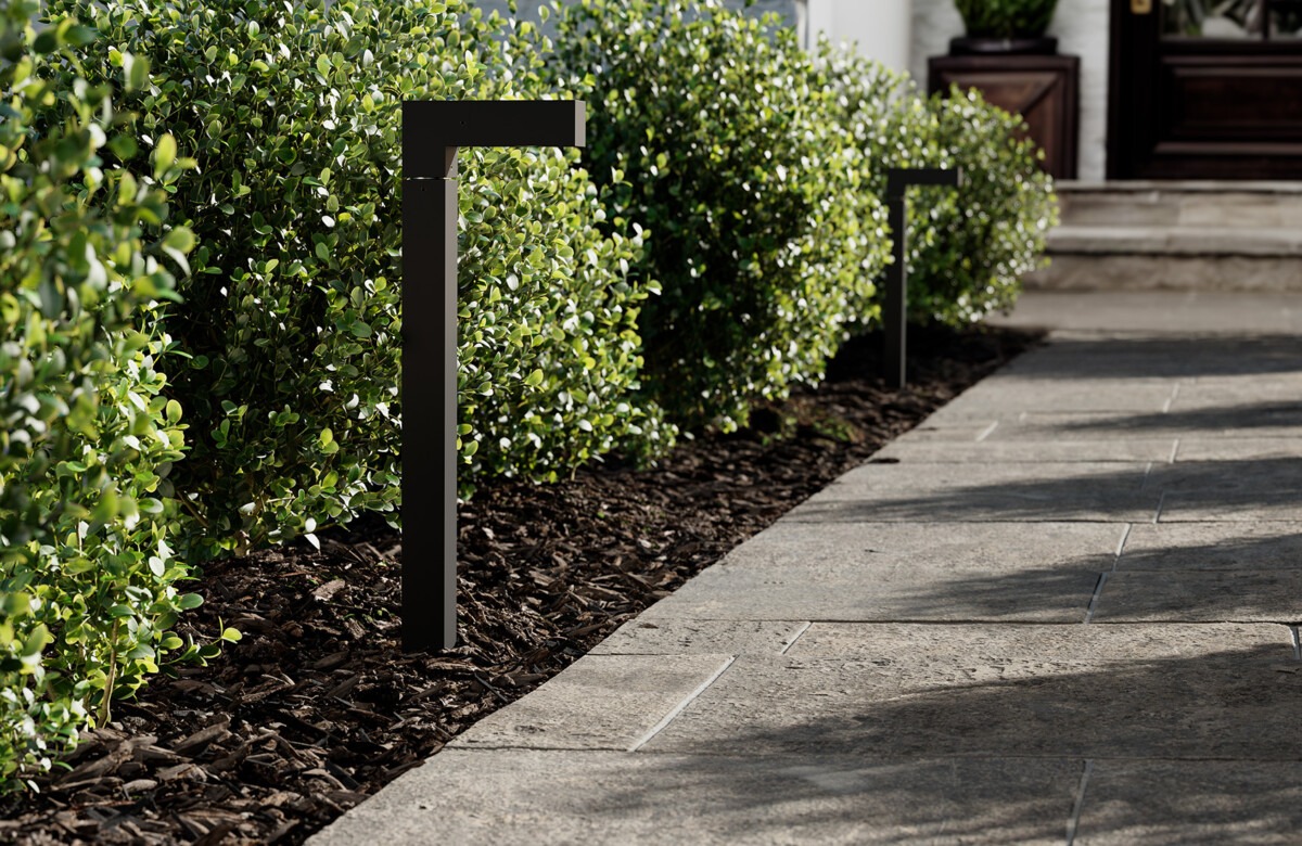 pathway lit by low-voltage LED bollard lights