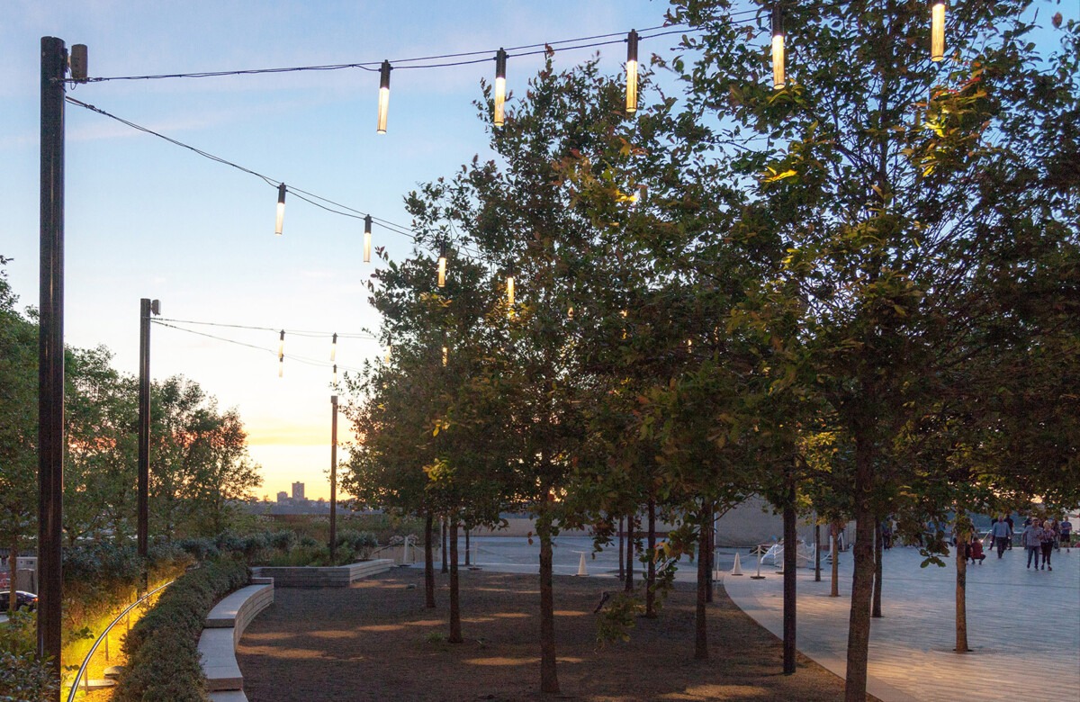 Modern outdoor pathway illuminated by hanging LED landscape lights